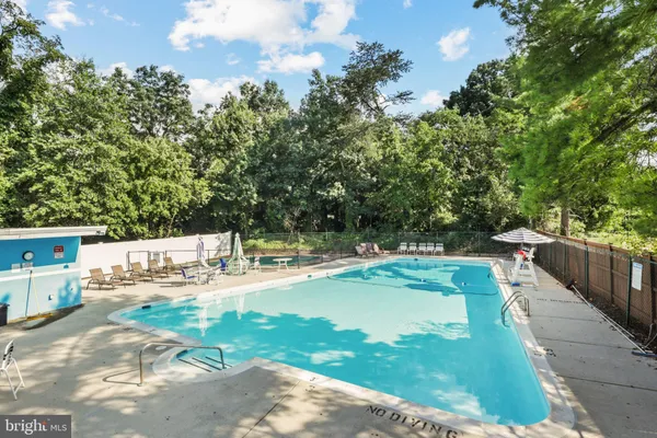 a view of a swimming pool with a patio