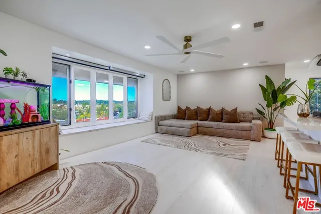 a bedroom with furniture and a lamp