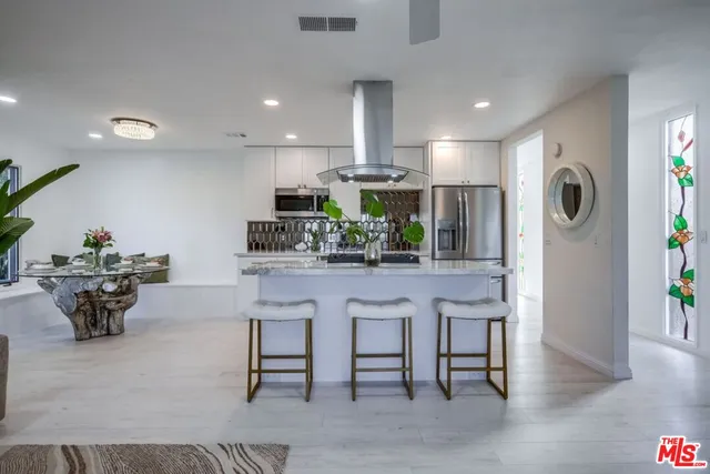 a bedroom with furniture and a mirror