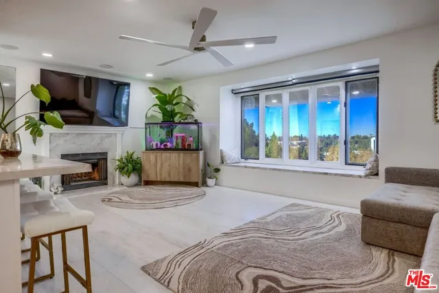 a bedroom with a large bed and potted plant