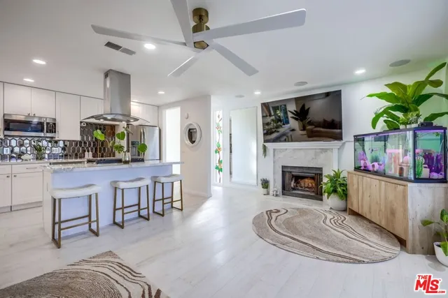 a view of balcony with wooden floor and outdoor seating