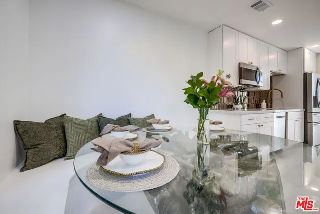 a view of a chairs and table in the patio