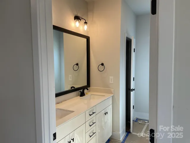 a bathroom with a shower and a sink