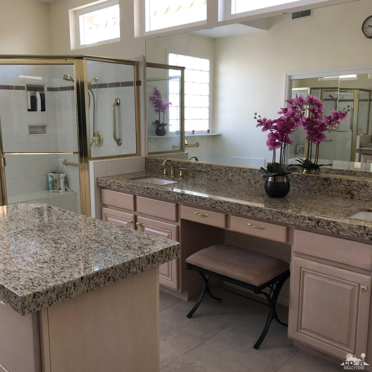 78121 Hunter Point Road Palm Desert, CA 92211 - Photo 10 of 12 a kitchen with a sink dishwasher and a refrigerator