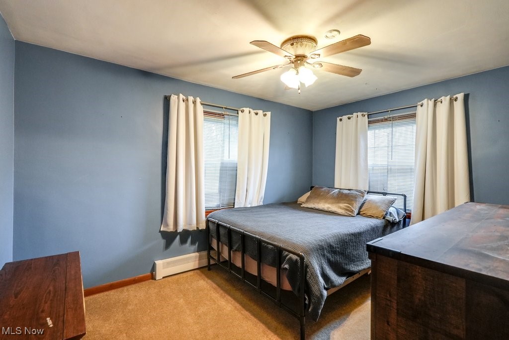 3204 Old Forge Road Kent, OH 44240 - Photo 30 of 42 Carpeted bedroom featuring ceiling fan and a baseboard radiator