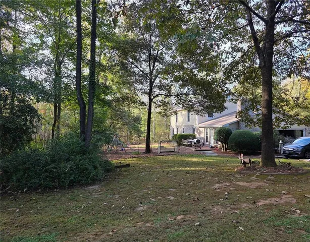 a view of a park with large trees