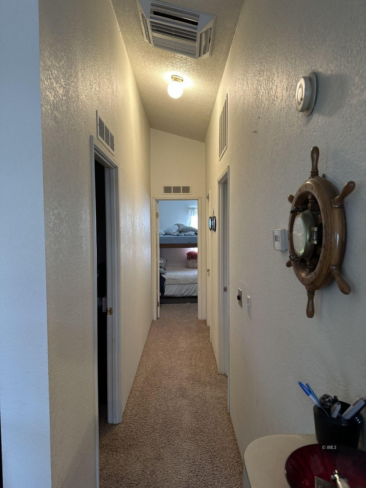 150 Tinnemaha Road, Unit C2 Big Pine, CA 93513 - Photo 18 of 28 a view of hallway with washer and dryer