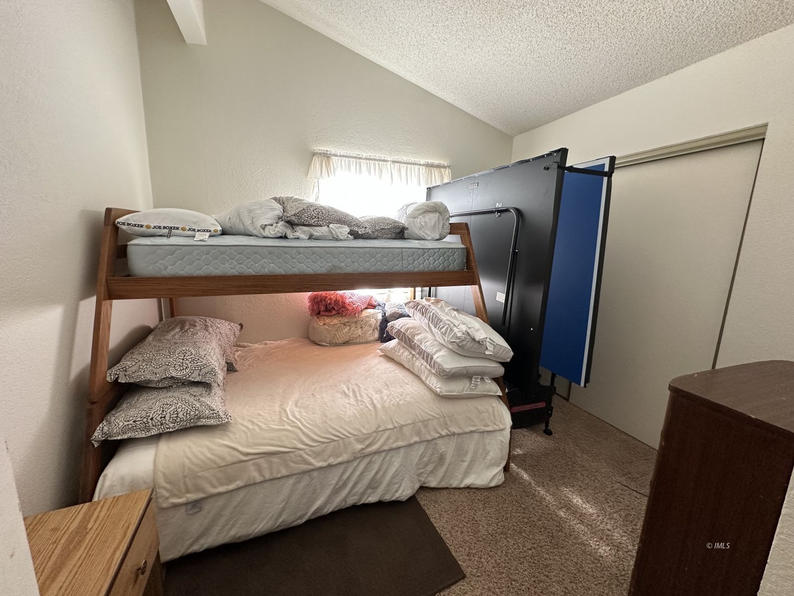 150 Tinnemaha Road, Unit C2 Big Pine, CA 93513 - Photo 5 of 28 a bedroom with a bed and wooden floor