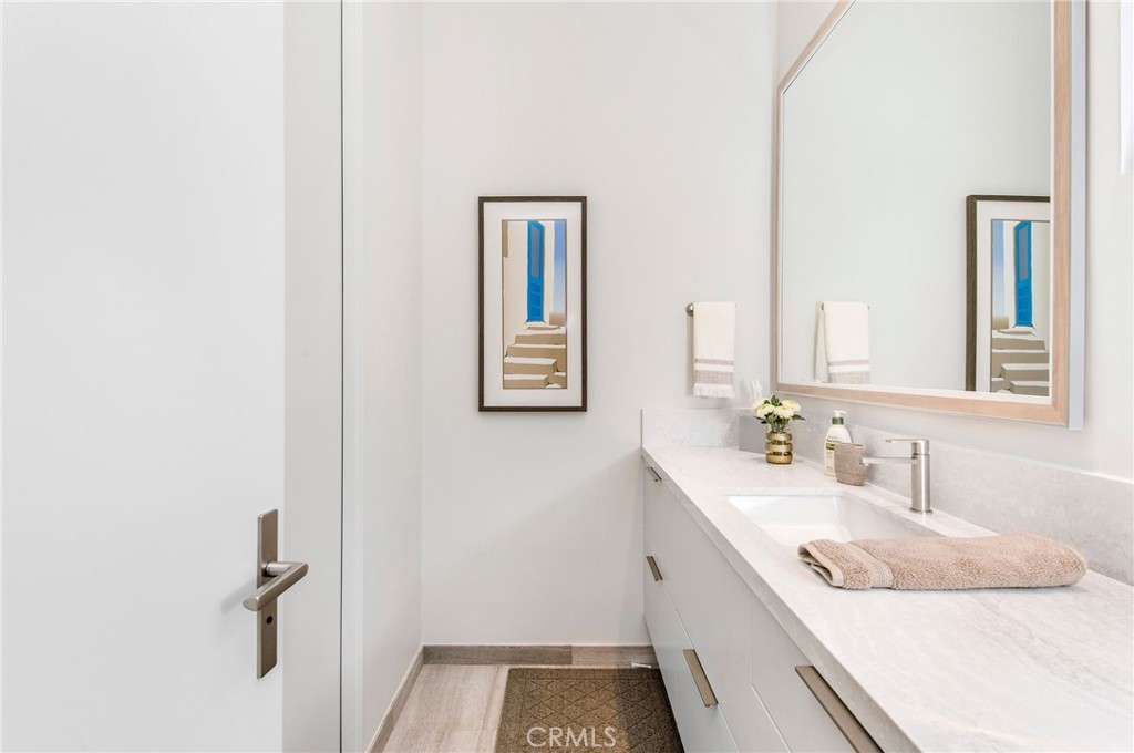 37 Monarch Bay Drive Dana Point, CA 92629 - Photo 23 of 37 a bathroom with a granite countertop sink and a mirror