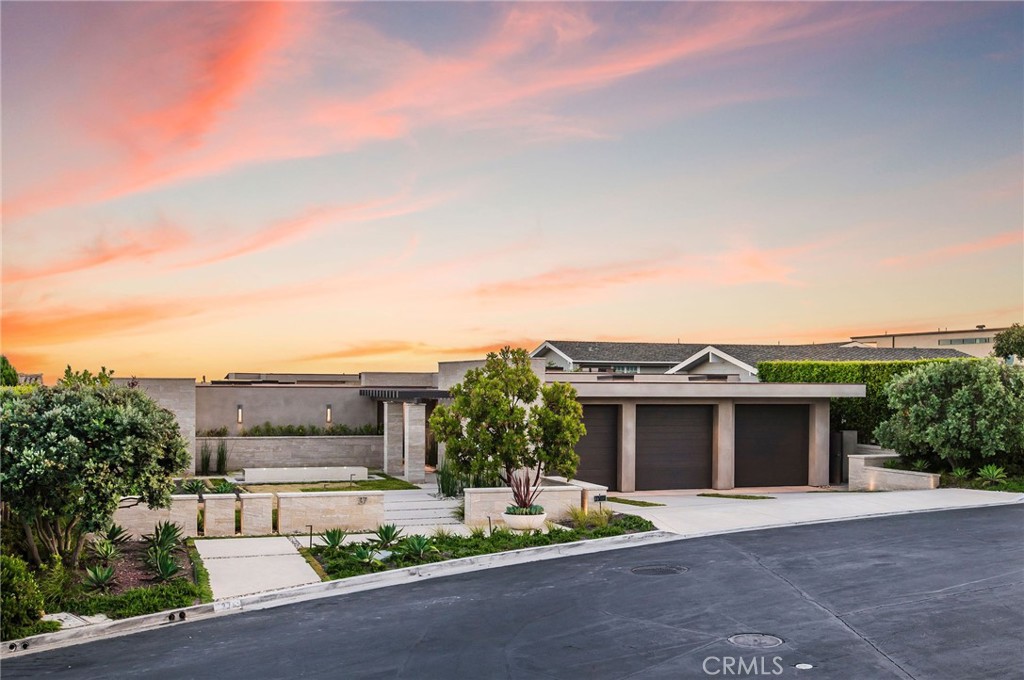37 Monarch Bay Drive Dana Point, CA 92629 - Photo 26 of 37 a front view of a house with a garden and plants