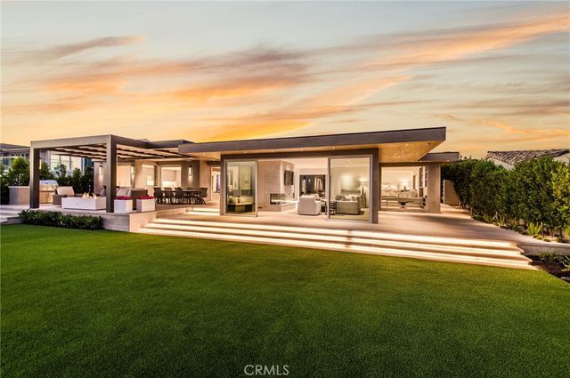 a view of pool with brick walls and floor to ceiling window