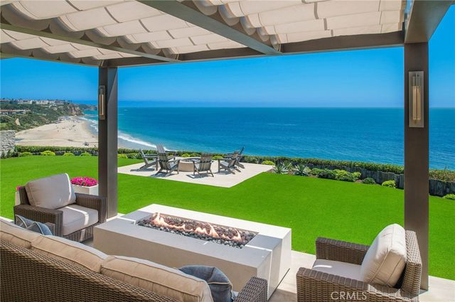a view of a chairs and table in the patio