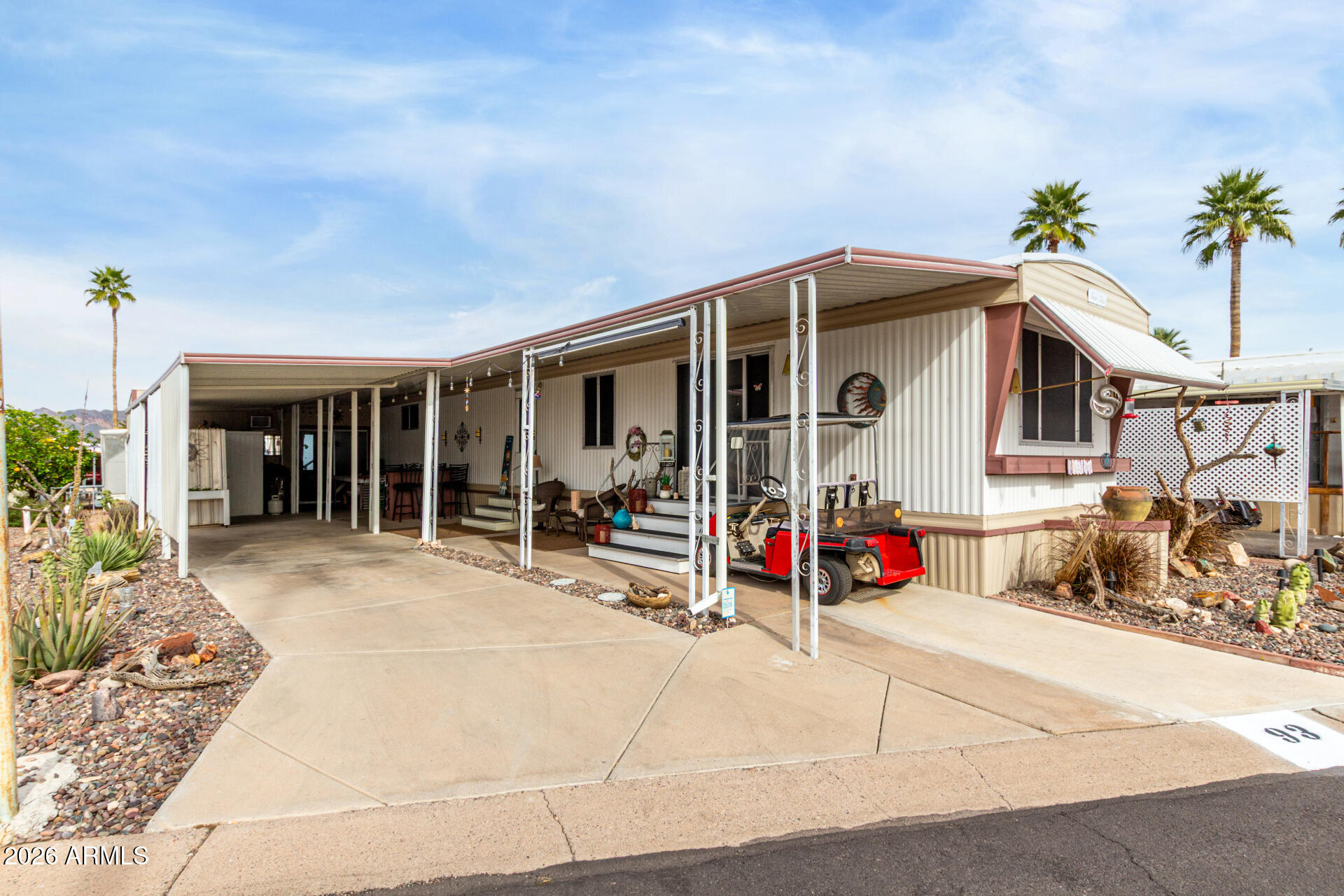 800 West Apache Trail, Unit 93 Apache Junction, AZ 85120 - Photo 14 of 28 a view of a house with porch and sitting area
