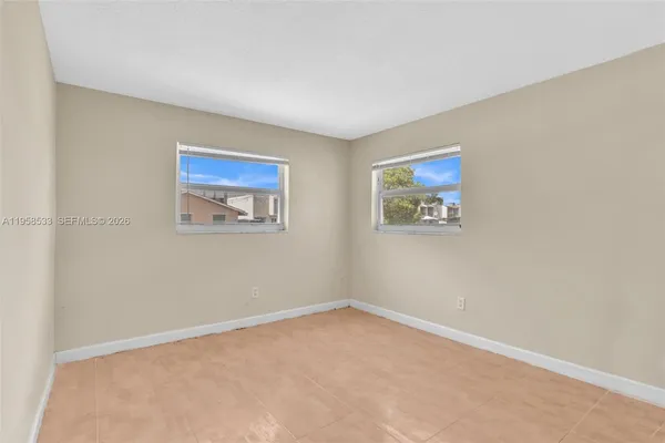 an empty room with windows