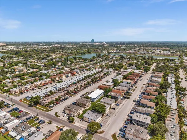 an aerial view of residential building and ocean