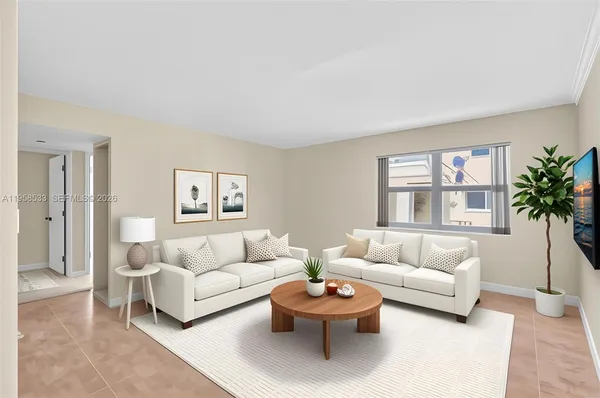 a living room with furniture and a large window