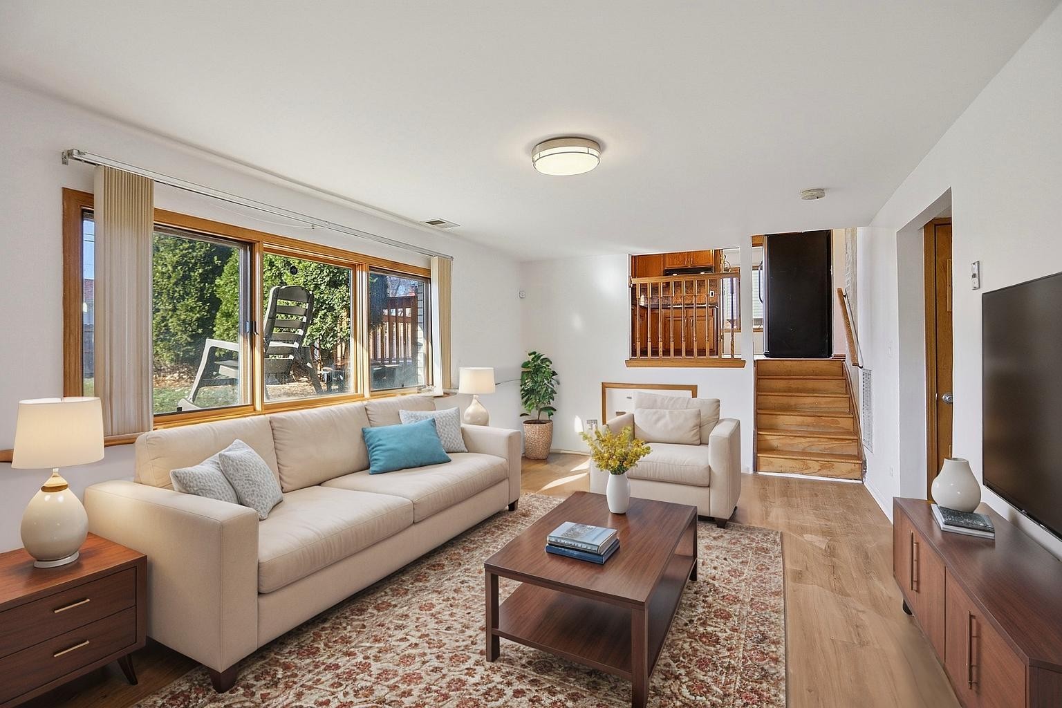 16408 Turner Avenue Markham, IL 60428 - Photo 12 of 24 a living room with furniture a rug and a flat screen tv