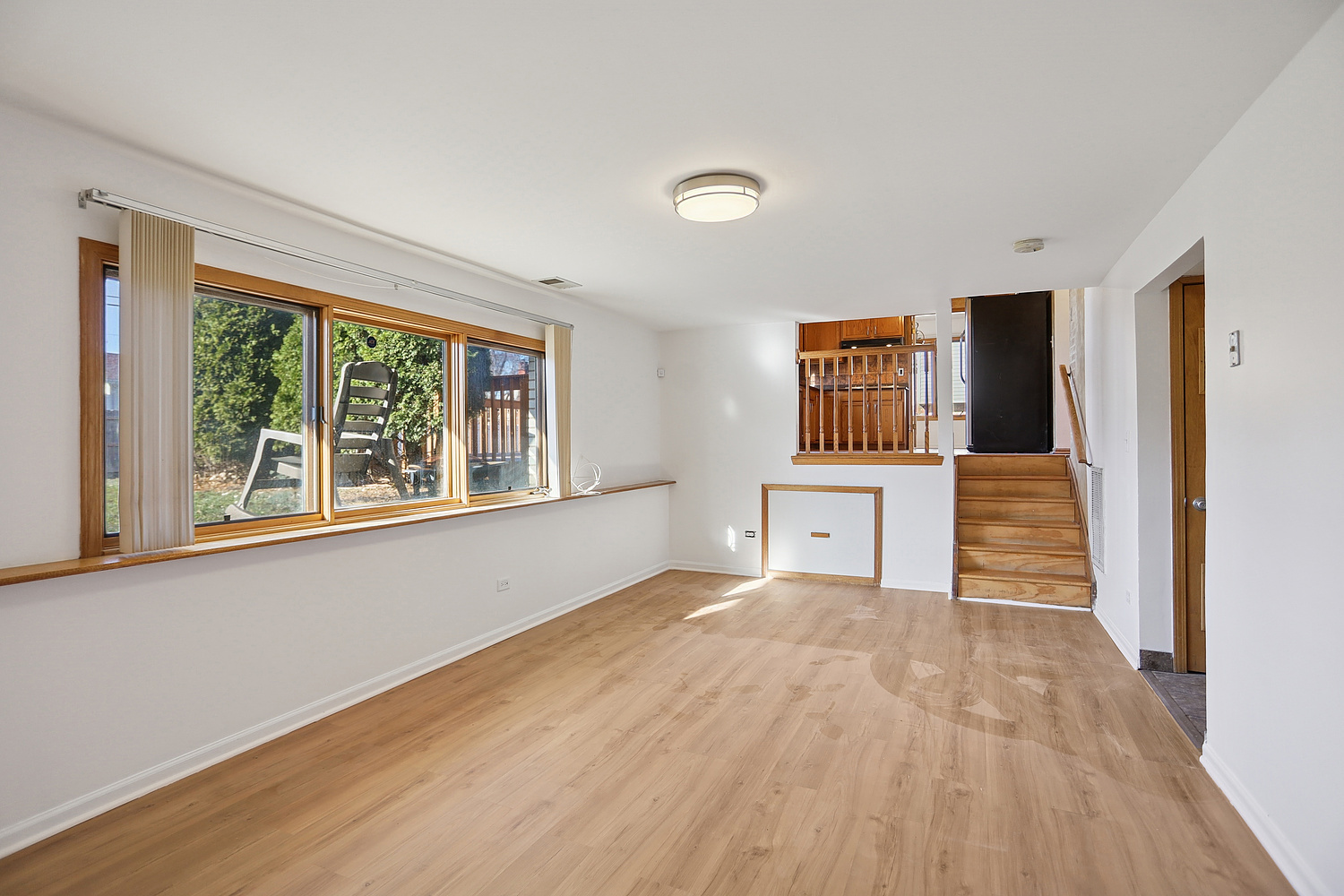 16408 Turner Avenue Markham, IL 60428 - Photo 13 of 24 a view of a hallway with wooden floor and a fireplace