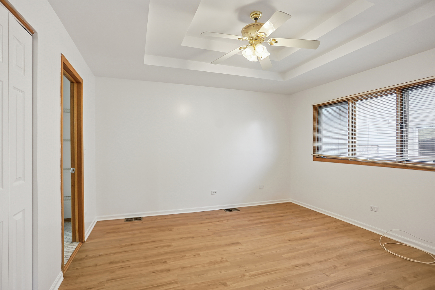 16408 Turner Avenue Markham, IL 60428 - Photo 15 of 24 a view of a room with a ceiling fan and wooden floor