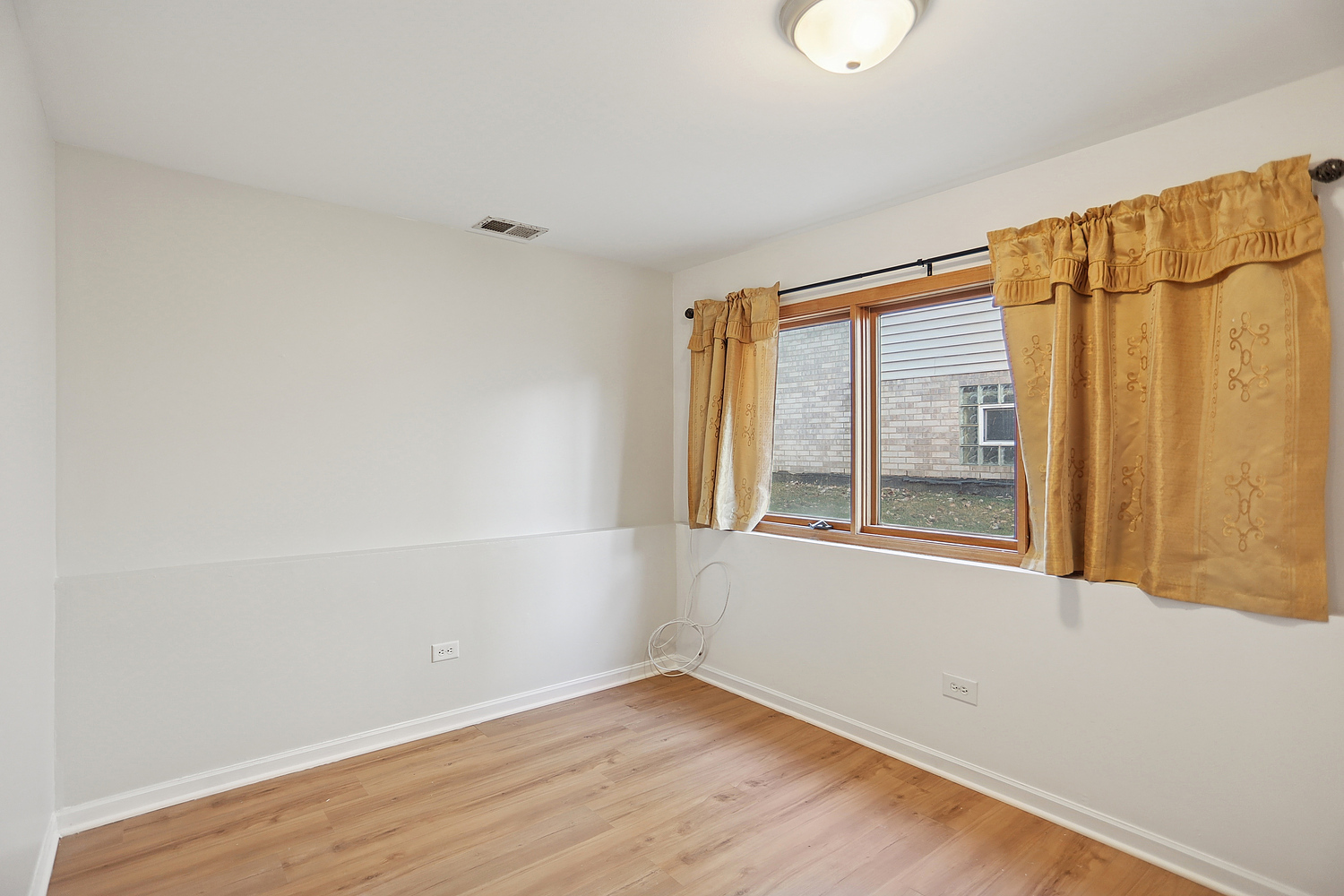 16408 Turner Avenue Markham, IL 60428 - Photo 21 of 24 an empty room with wooden floor and windows
