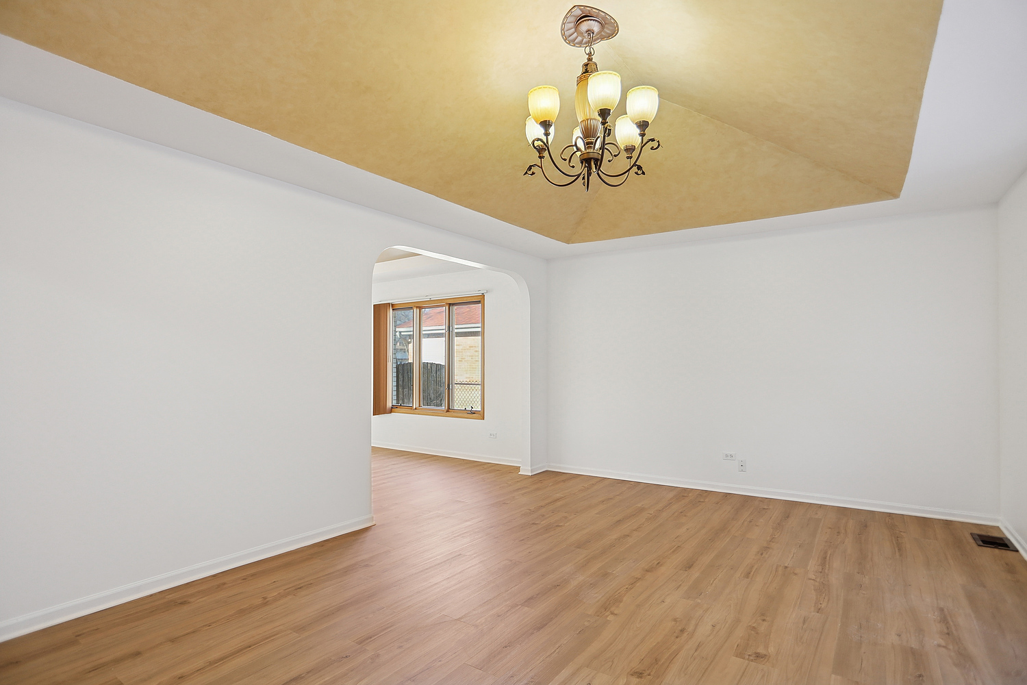 16408 Turner Avenue Markham, IL 60428 - Photo 4 of 24 a view of a chandelier and wooden floor in a room