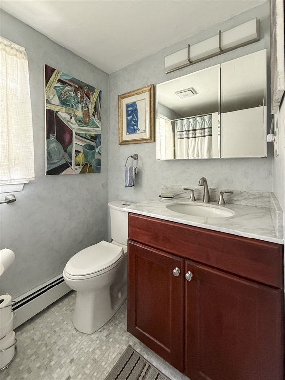 26 Merrill Road, Unit 26 Hull, MA 02045 - Photo 24 of 24 a bathroom with a sink toilet and mirror