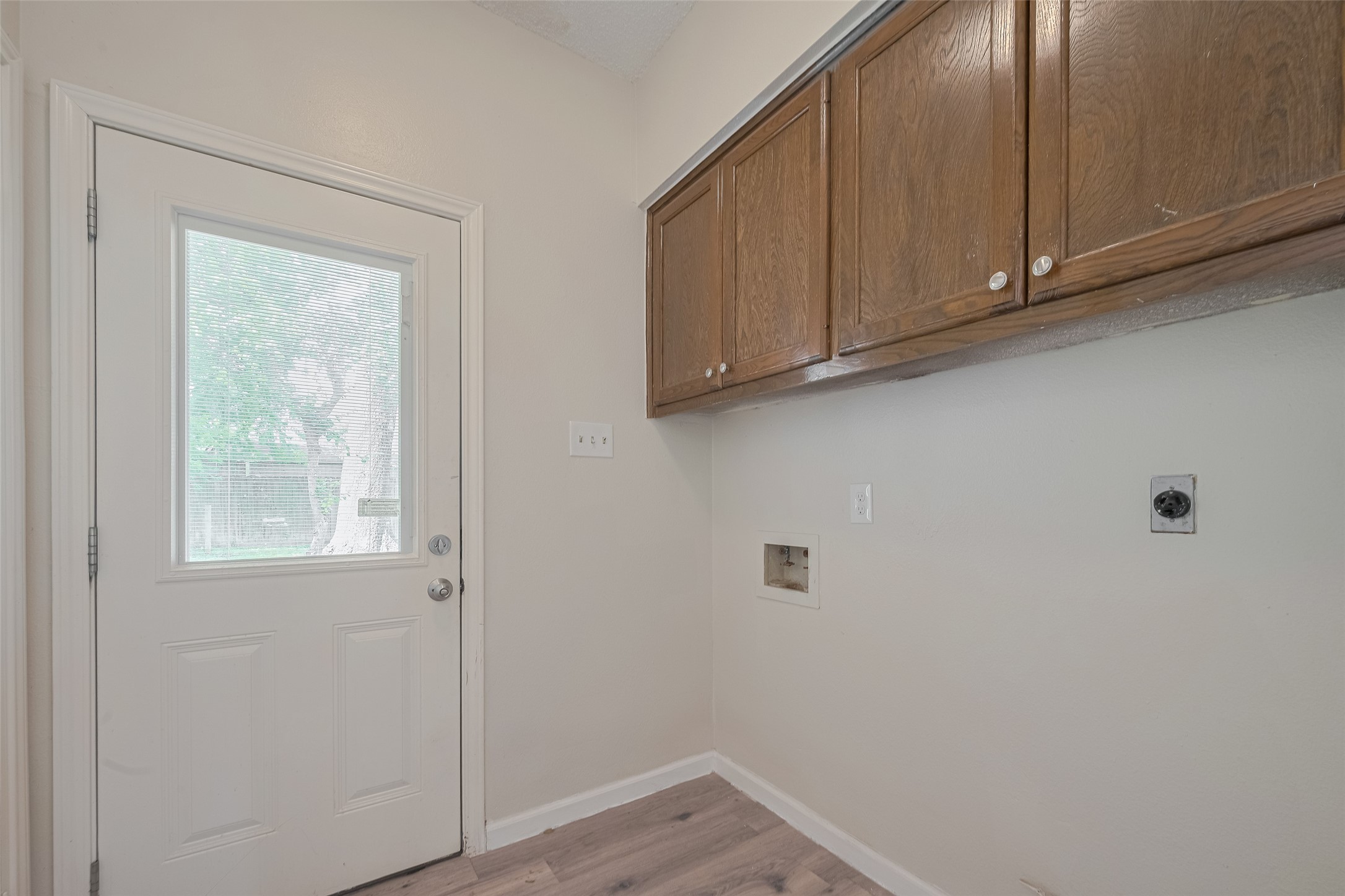 5210 Holly View Drive Houston, TX 77091 - Photo 12 of 31 Washroom with cabinets for storage. Also shelves on other side for storage as well!