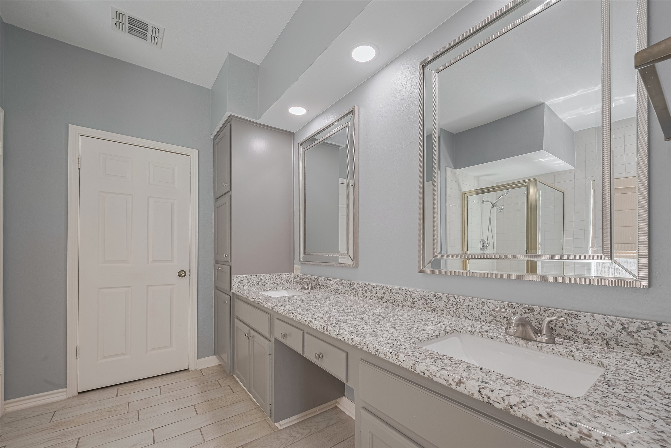 5210 Holly View Drive Houston, TX 77091 - Photo 20 of 31 Primary bath has built in linen closet and dual sinks.