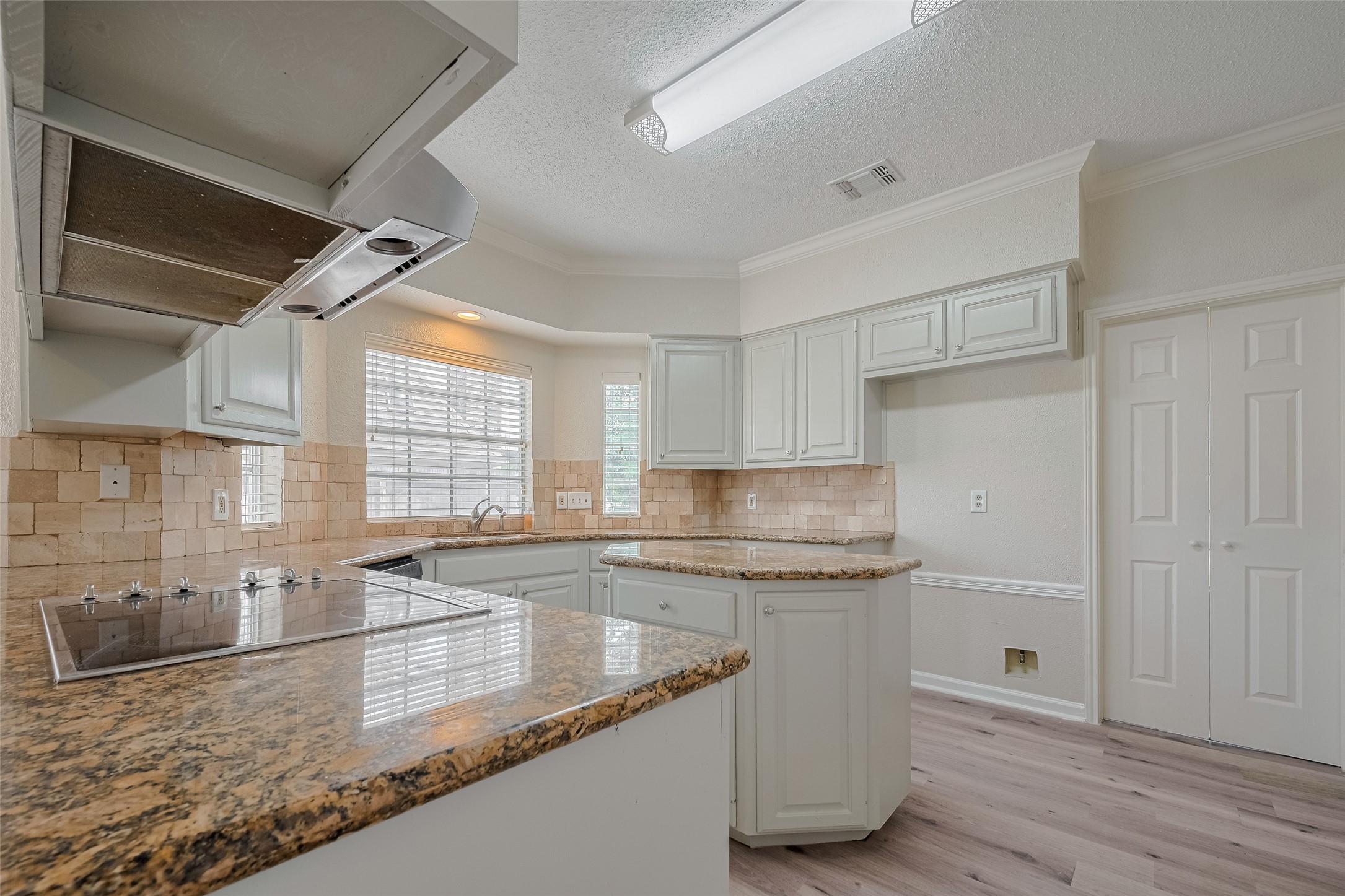 5210 Holly View Drive Houston, TX 77091 - Photo 9 of 31 Nice kitchen with island, granite countertops and stainless steel appliances