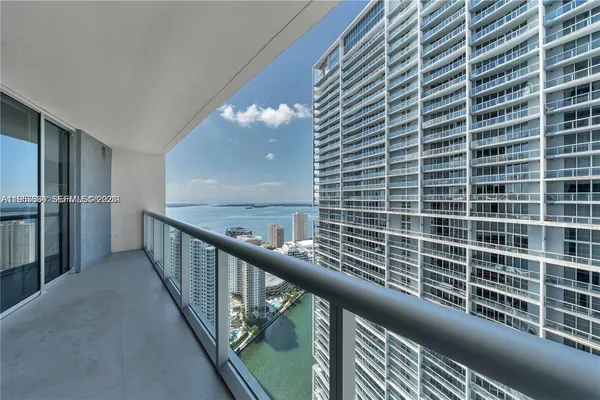 a view of balcony with furniture