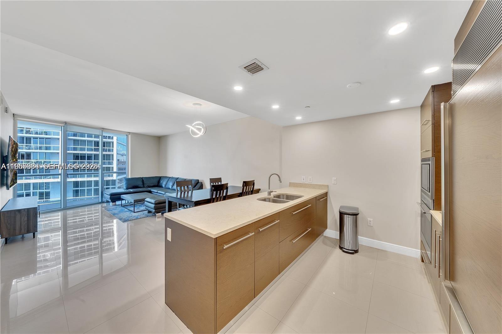 475 Brickell Avenue, Unit 4211 Miami, FL 33131 - Photo 6 of 10 a large white kitchen with a large window