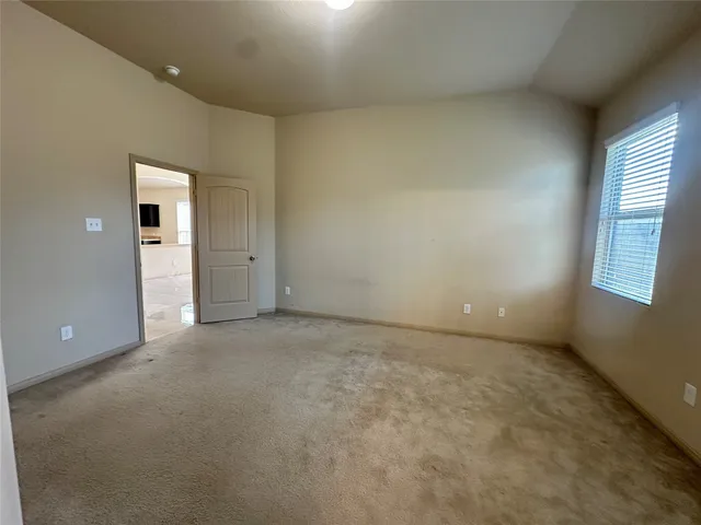 a bathroom with a double vanity sink a mirror and a bathtub