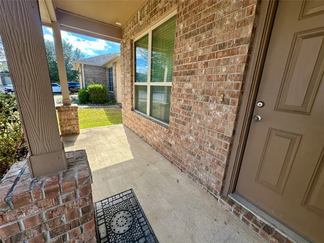 a view of a hallway with a chandelier