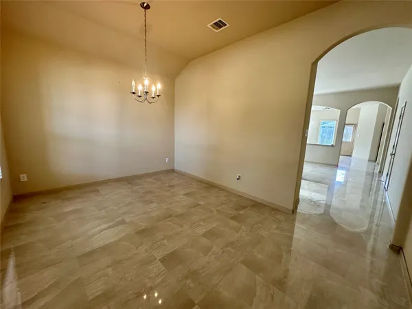 a view of a hallway with a bathroom