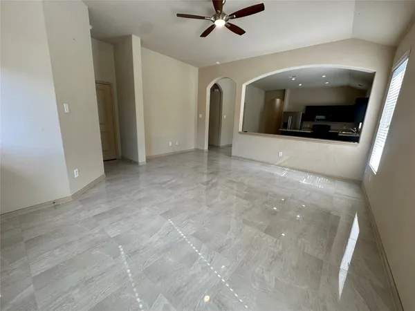 a view of an empty room with a window