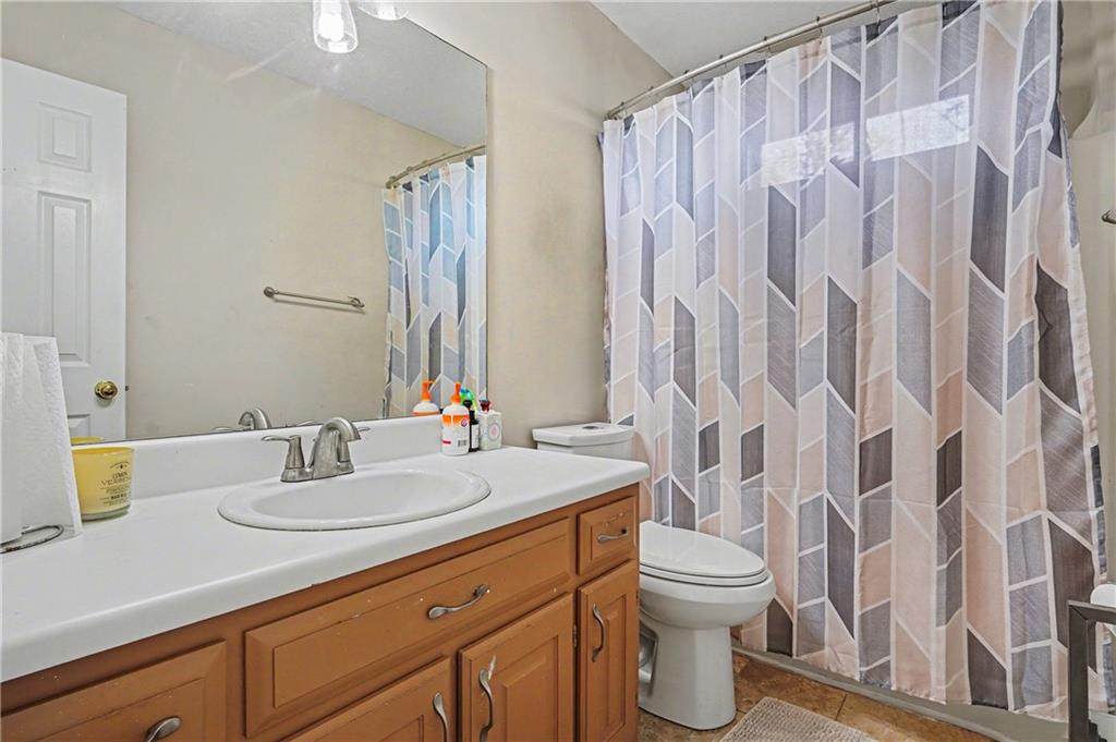 570 Morgan Court Hampton, GA 30228 - Photo 24 of 31 a bathroom with a sink and a mirror