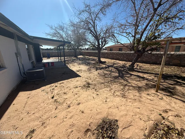a view of a backyard of the house