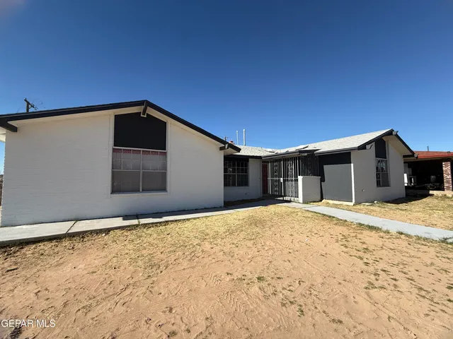a house with trees in the background