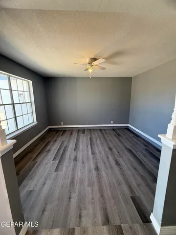 wooden floor in a hall with a window