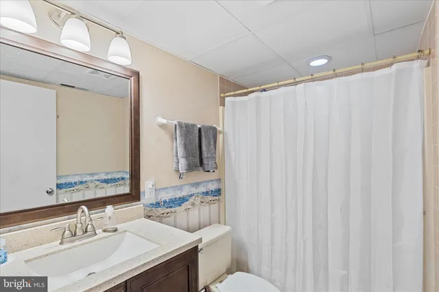 a view of a balcony with chairs and wooden floor