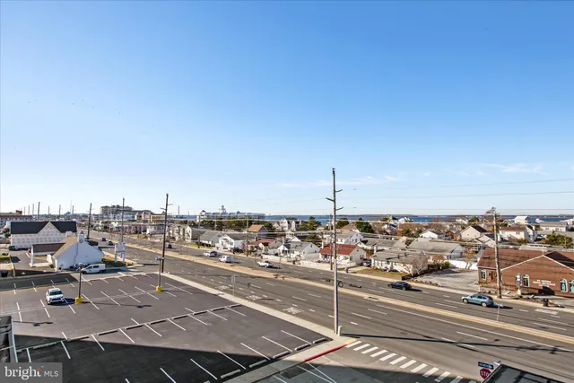 an aerial view of a city with ocean view