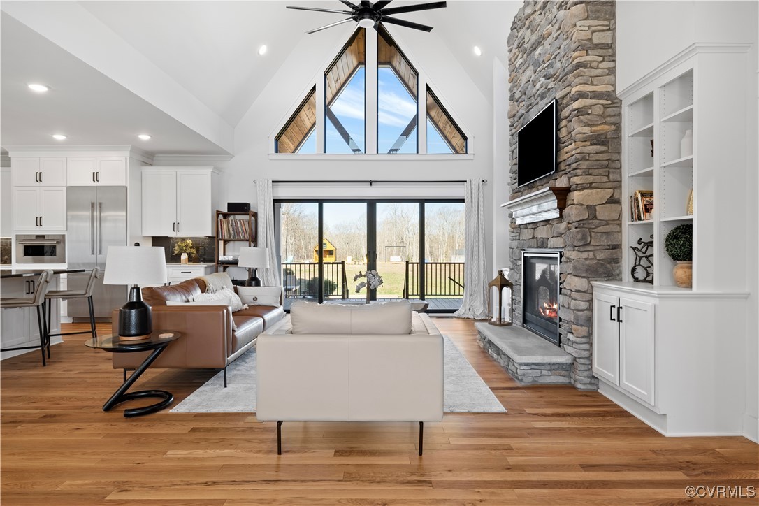 1897 State Rte 635 Midlothian, VA 23113 - Photo 6 of 50 Living room with a ceiling fan, a stone fireplace,