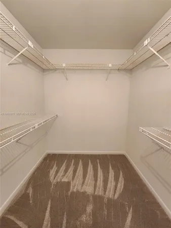 a view of a room with racks on the wall