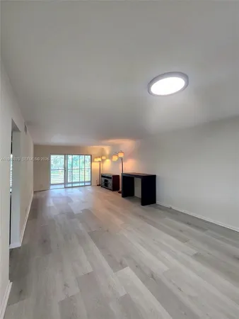 a view of empty room with windows