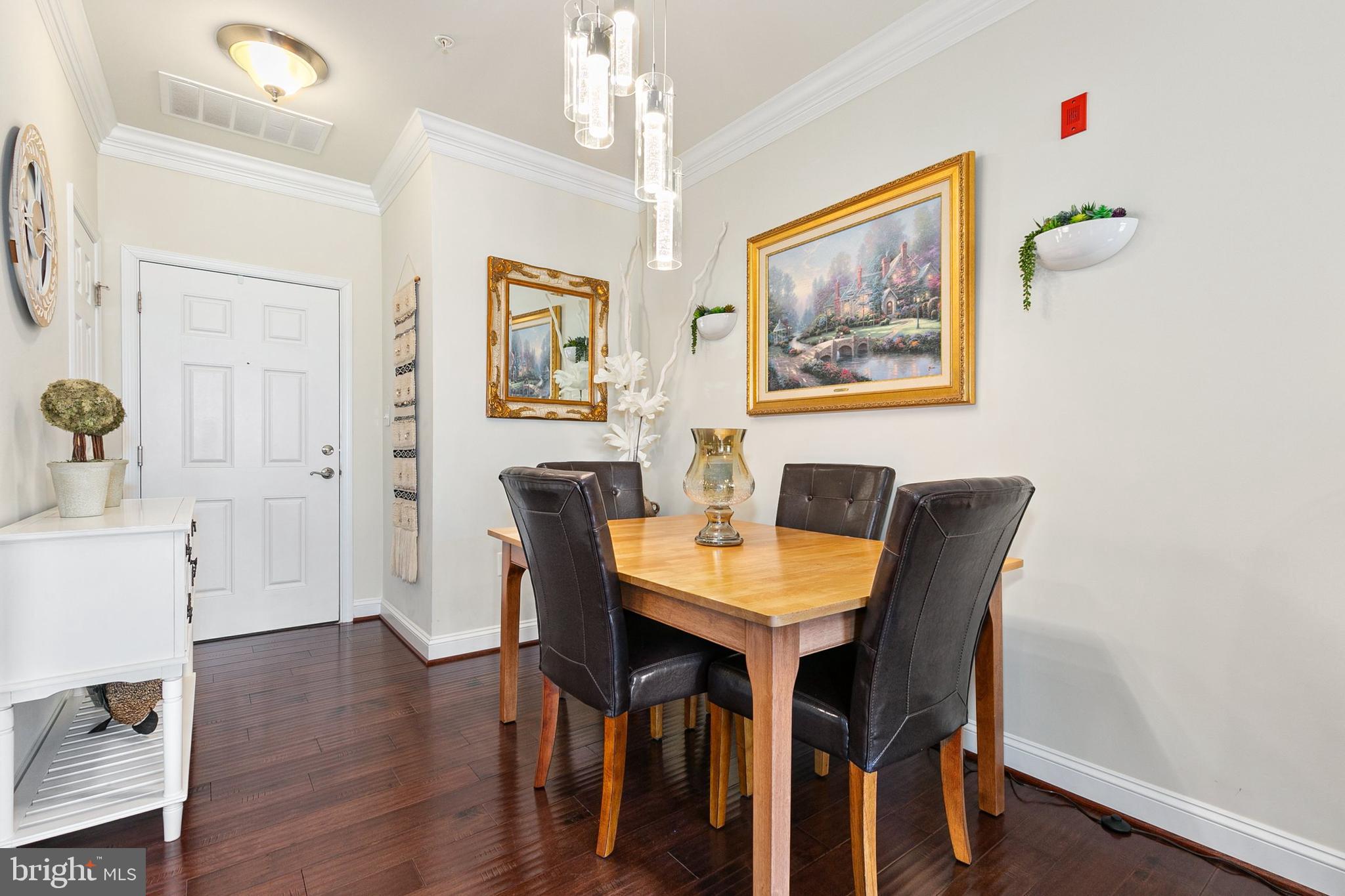 3825 Doc Berlin Drive, Unit 25 Silver Spring, MD 20906 - Photo 14 of 41 a view of a dining room with furniture and wooden floor