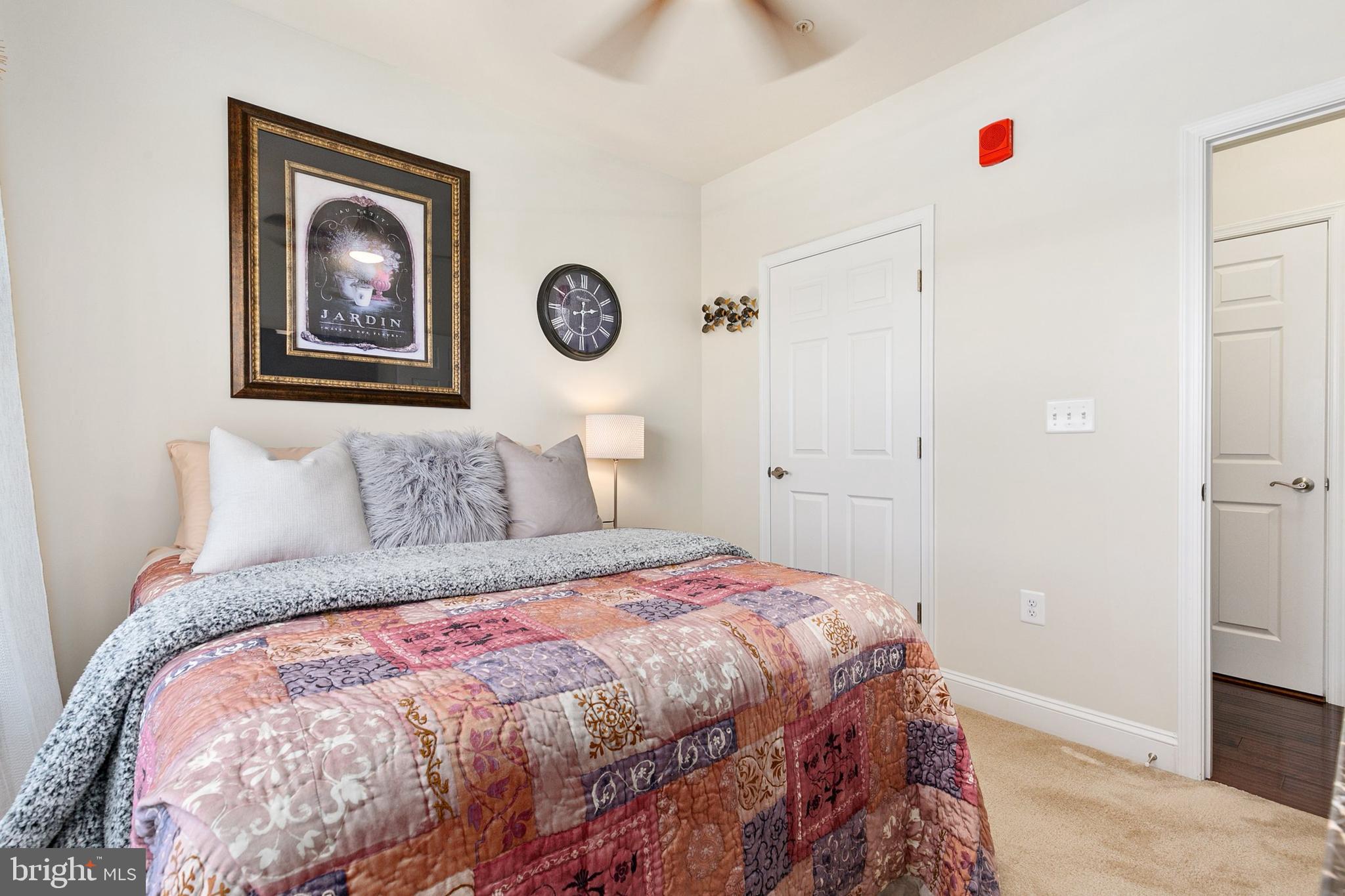 3825 Doc Berlin Drive, Unit 25 Silver Spring, MD 20906 - Photo 16 of 41 a bedroom with bed and wooden floor