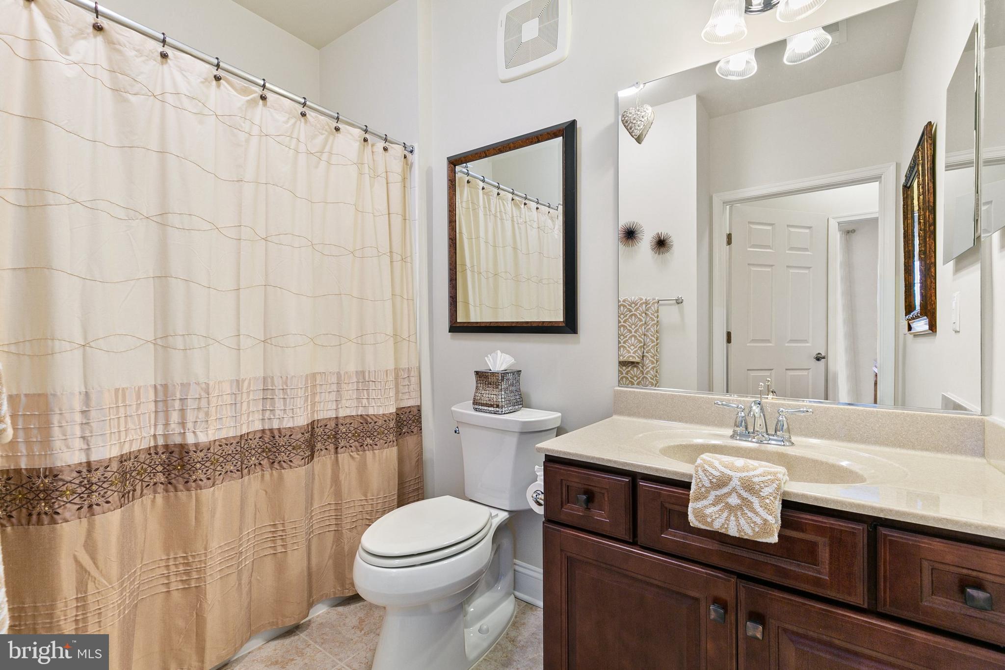 3825 Doc Berlin Drive, Unit 25 Silver Spring, MD 20906 - Photo 21 of 41 a bathroom with a sink a toilet and shower