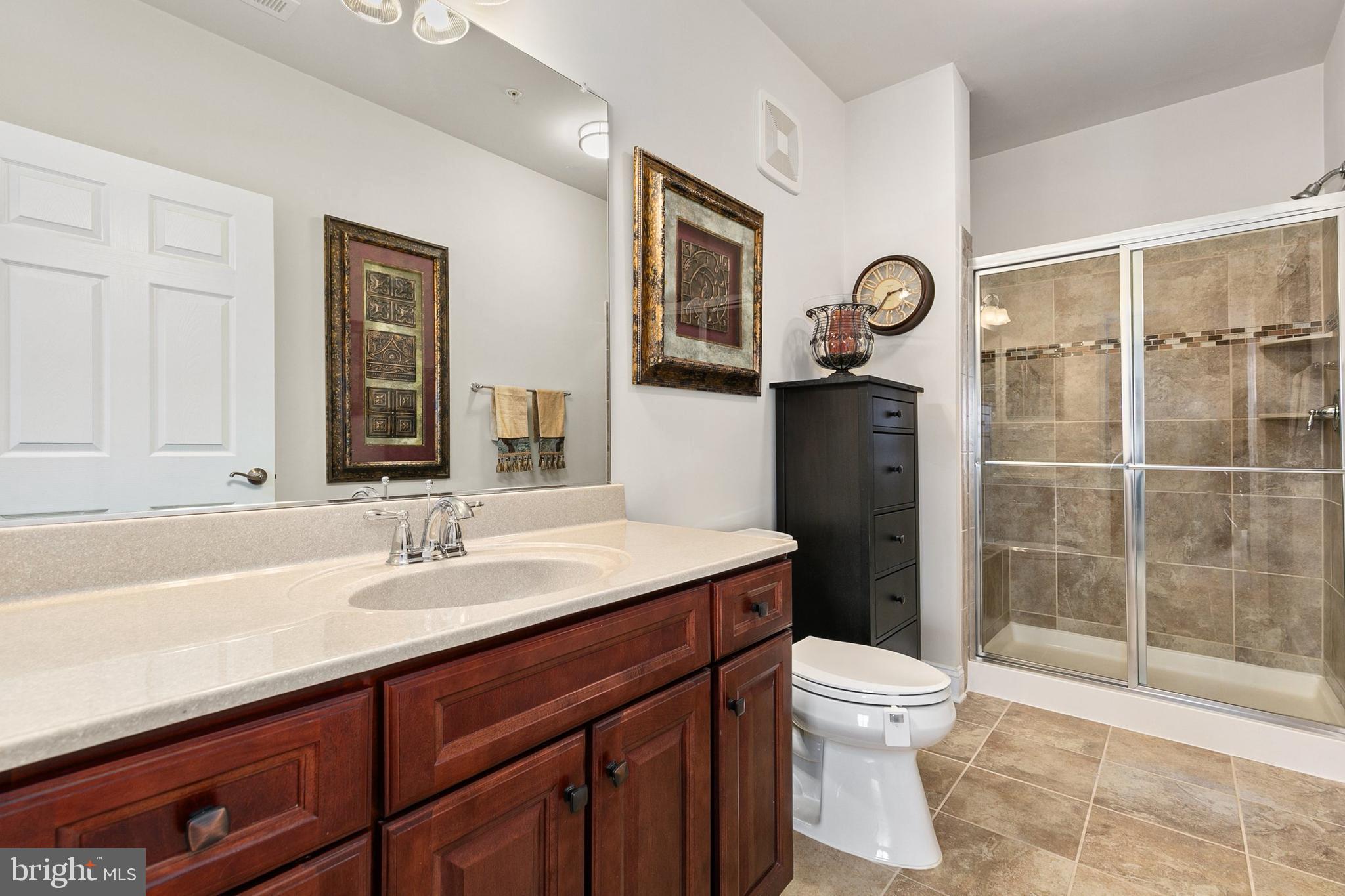 3825 Doc Berlin Drive, Unit 25 Silver Spring, MD 20906 - Photo 22 of 41 a bathroom with a sink a toilet and shower