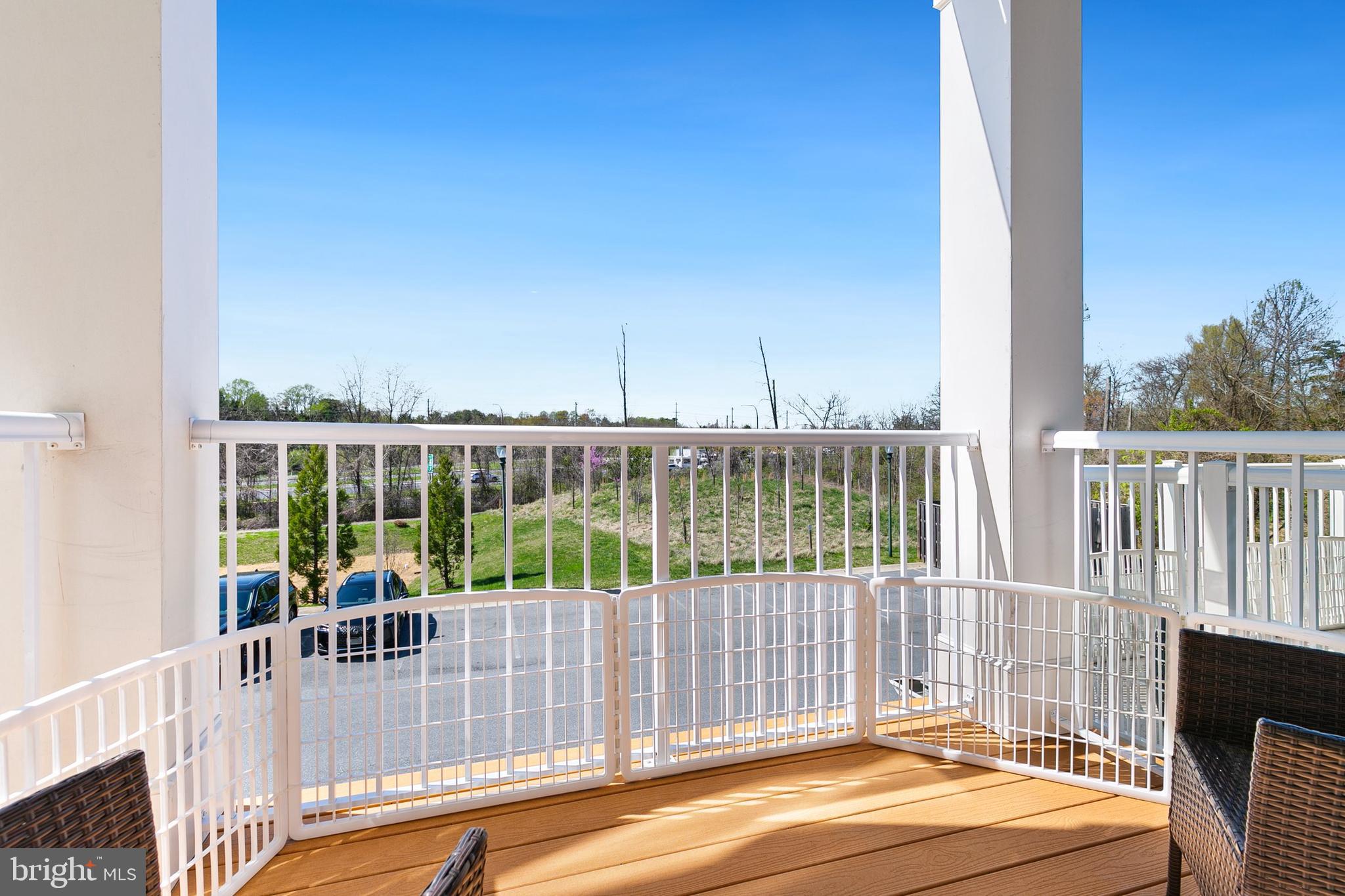 3825 Doc Berlin Drive, Unit 25 Silver Spring, MD 20906 - Photo 23 of 41 a view of a balcony with floor to ceiling window and wooden fence