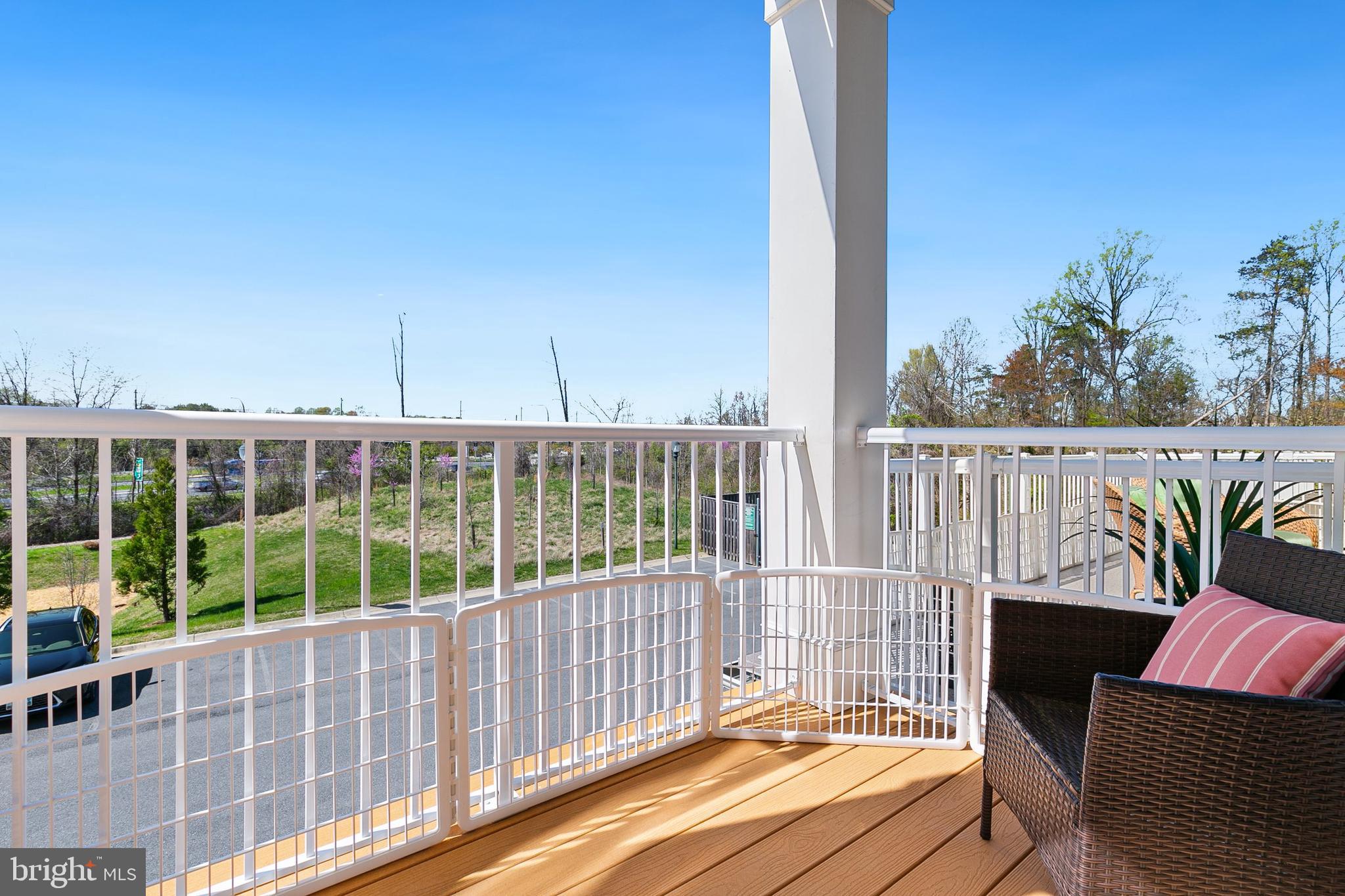 3825 Doc Berlin Drive, Unit 25 Silver Spring, MD 20906 - Photo 24 of 41 a view of a balcony with wooden floor and iron fence